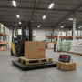 Balance plateforme utilisée dans un entrepôt pour peser une palette chargée