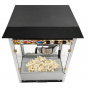 Machine à pop-corn avec cuve de préparation et pop-corn visible dans la vitrine