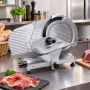 Trancheuse installée sur un plan de travail en cuisine professionnelle.
